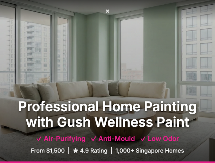 Modern living room with large windows and a sofa, featuring Gush Wellness Paint advertisement. Pico X Health
